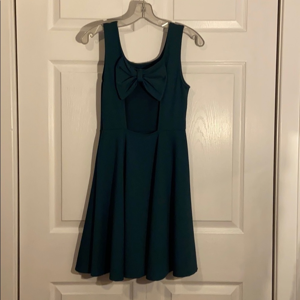 Emerald green dress with cut out and bow on back